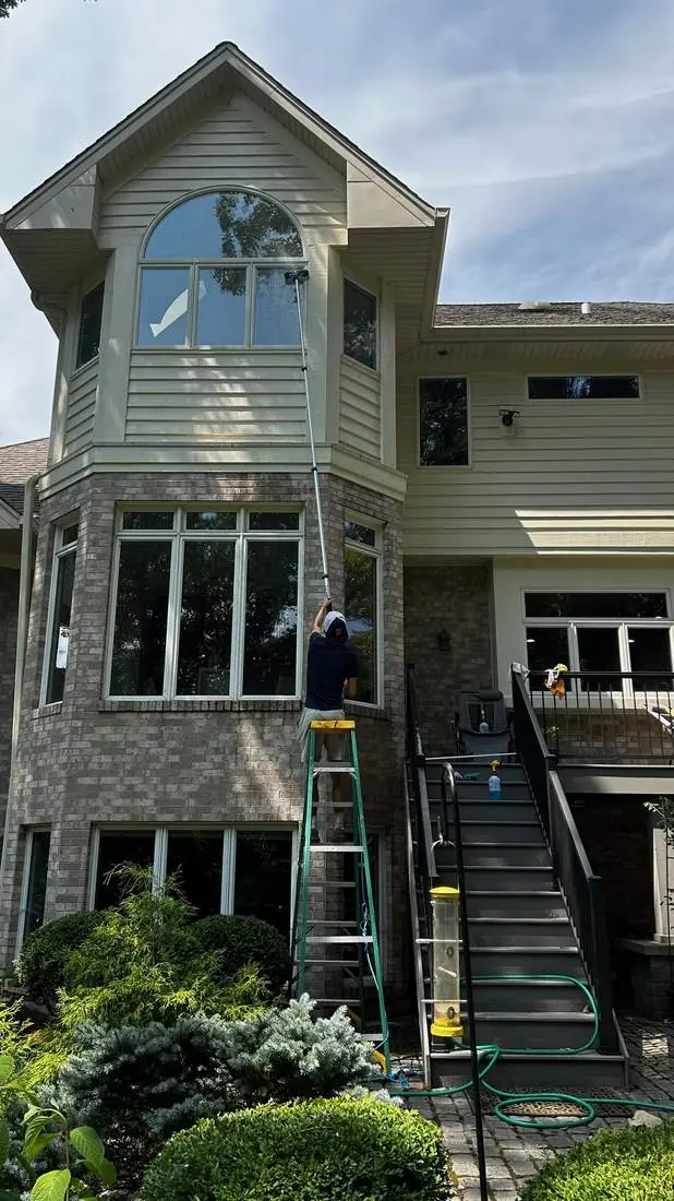 True North Services crew washing windows on a North Shore home