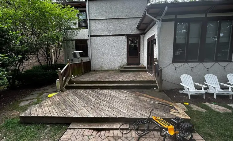Deck and gutter cleaning in progress
